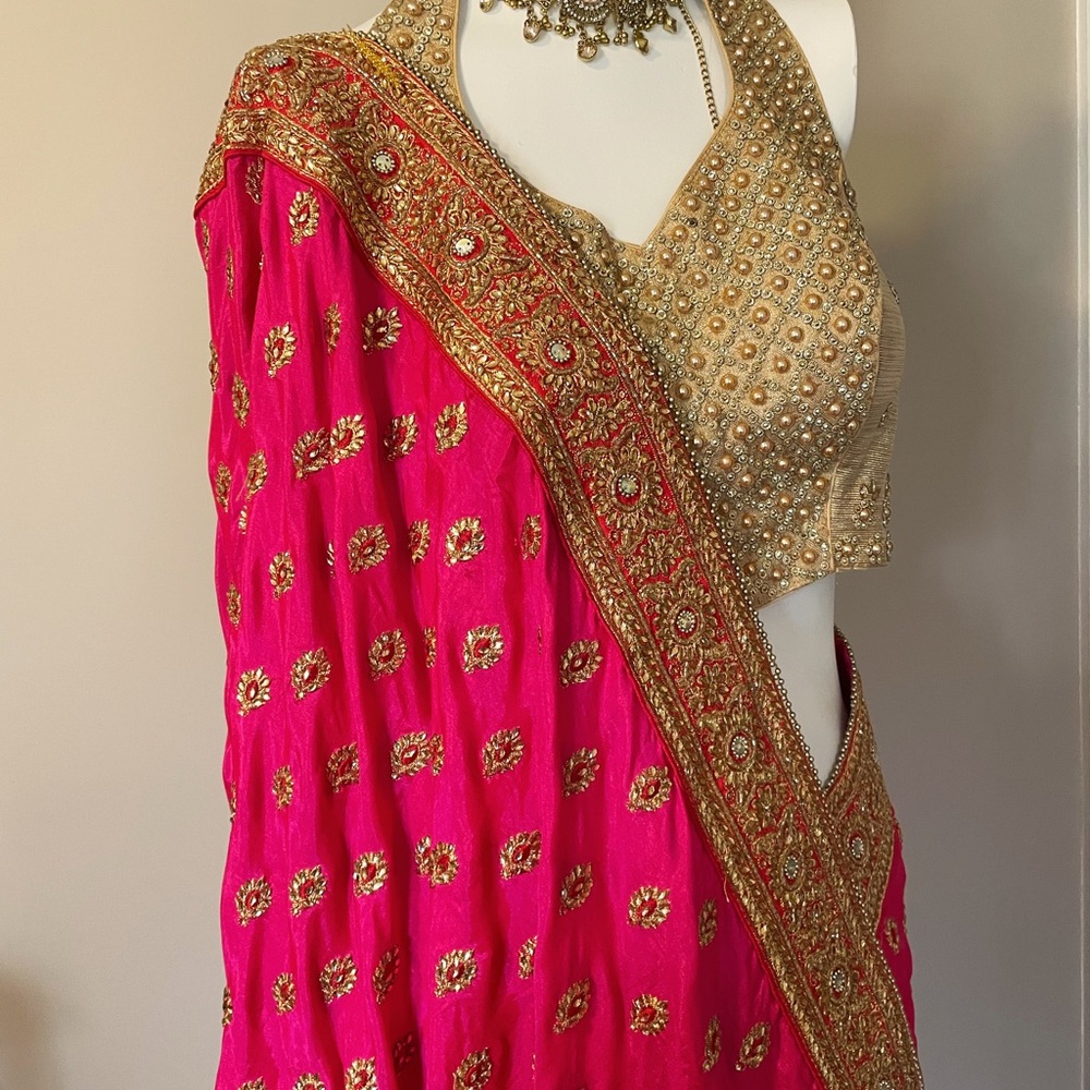 Vibrant Hot Pink Sari with Gold Embellishments